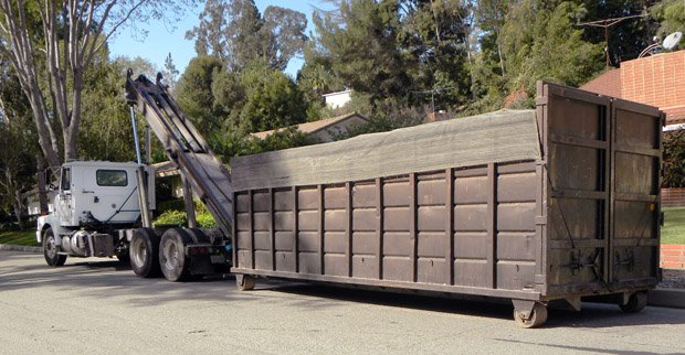 Brown 40-yard dumpster with tarp cover